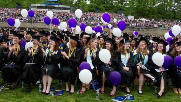 Members of the Class of 2013 sit at Butterfield Stadium during the Commencement ceremony Sunday. With over 2000 students, this year's class was the largest in the college's history.