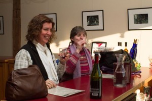 From left, Jacky Knoll-Carr from Oxford, N.Y., and Christine Gregoire from Whitney Point, N.Y., enjoy a wine tasting at Six Mile Creek Vineyard in Ithaca. KEVIN CAMPBELL/THE ITHACAN