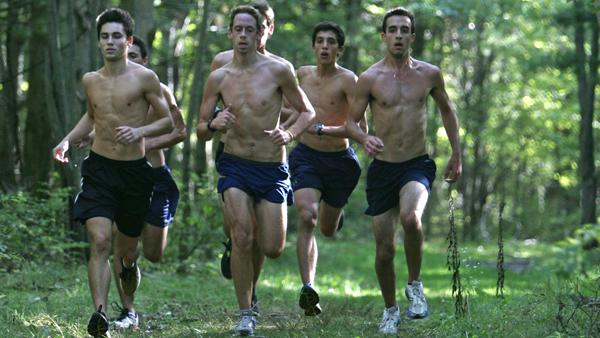 Sophomore runner Niko Athanasatos, pictured far right, runs in a pack with his teammates during a mens cross country practice Monday afternoon.