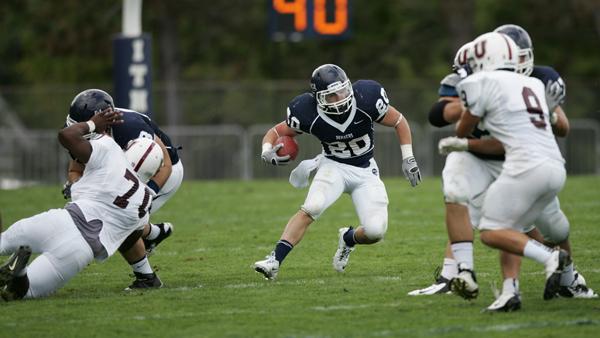 Senior running back Jarrett Naiden looks for a hole during the football teams 27-24 overtime win against Union College on Saturday.