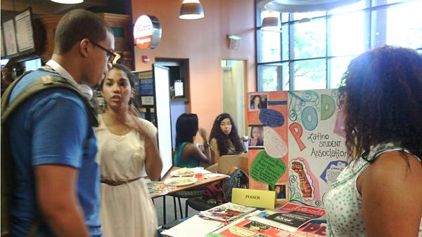 Melissa Cepeda, center, speaks to Carlos Grimes, left, and Kiara Lora August 28 at the ALANA BBQ held in IC Square. ALANA is a part of the Latino Students Association participating in Latino Heritage Month.