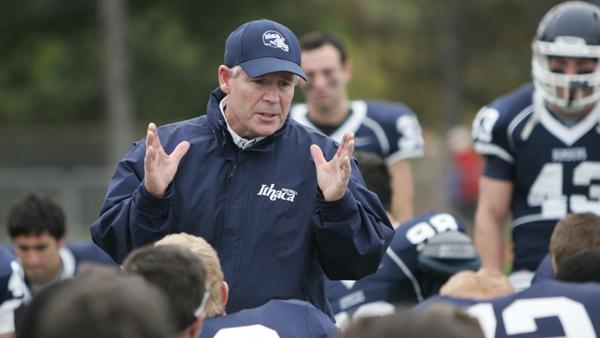 Ithaca College football Head Coach Mike Welch addresses his players after the Bombers 21-14 loss to Buffalo State on Saturday. Welch will be taking an indefinite leave of absence to undergo heart bypass surgery this week.