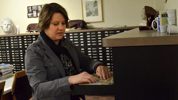 Visual Resources Curator Randi Millman-Brown sorts through slides of the Visual Resources Collection in Gannett Center.