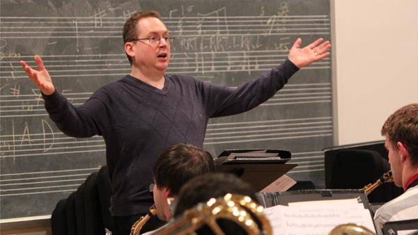 Mike Titlebaum, assistant professor of performance studies, emphatically leads a rehearsal for What is Jazz? in the Instrumental Rehearsal Room on Oct. 2.