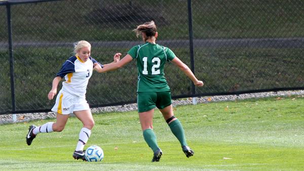 From left, freshman midfielder Kelsey King works a move on SUNY-Farmingdale sophomore defender Andrea Kiefer during the Bombers 3-0 victory against the Rams on Saturday on Carp Wood Field.
