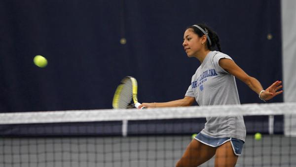 Senior Christina Nunez prepares for a volley during a practice for the womens tennis team in the Athletics and Events Center this season. Nunez pulled off a come-from-behind three set victory to claim the New York State championship in first singles on Oct. 14.