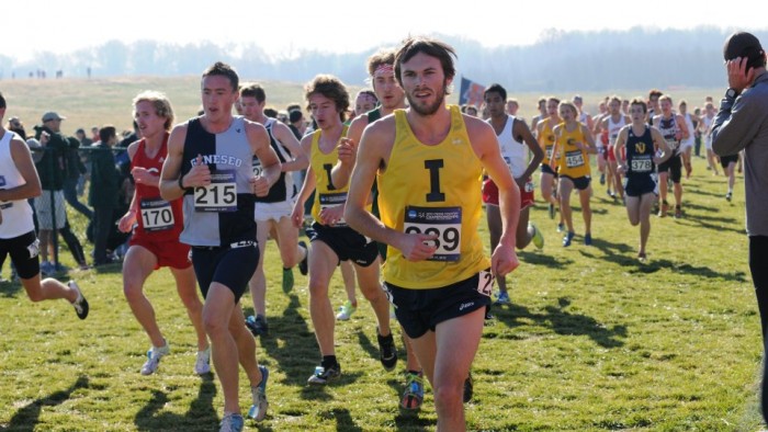 From left, freshman Sawyer Hitchcock and senior Nathan Bickell (pictured in yellow) compete during the NCAA Championship meet Nov. 17 in Terre Haute, Ind.