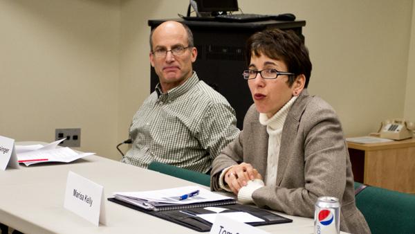 From left, Accounting Professor Warren Schlesinger and Provost Marisa 
Kelly discuss academic issues at the Faculty Council meeting Tuesday.
