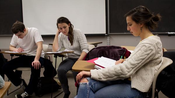 From left, seniors Greg Burns, Emily Nowels and Anika Steppe read and discuss entries for The Mirror magazine, a new campus health publication, at their meeting in Williams on Tuesday evening.