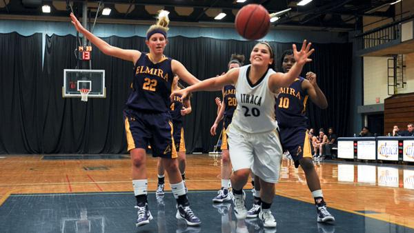 From left, Elmira guard Jessica Zoltowski and junior Jenn Escobido chase down a loose ball during a game last season.