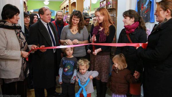 Bloom in Ithaca owners McKenzie Jones-Rounds and Draya Koschmann, center, officially open their store at the ribbon-cutting ceremony Dec. 5 at 134 The Commons. Bloom sells both children’s and women’s clothing.