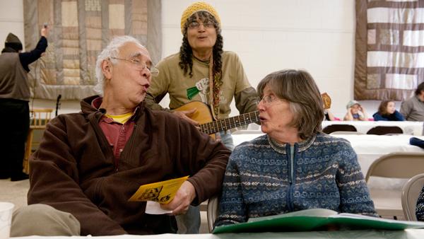 From left, Marty Hatch and his wife Susan sing along with local musician Aro Veno on Saturday at ABC Café for a Day.