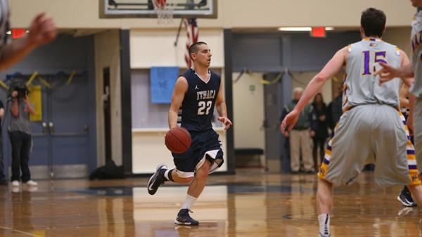 Senior guard Sean Rossi dribbles into Bomber territory during a game against Nazareth College in Ben Light Gymnasium on February 16th.
