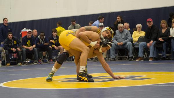 Senior Ricky Gomez wrestles an opponent from Wilkes University during a home match in Ben Light Gymnasium on February 15th.