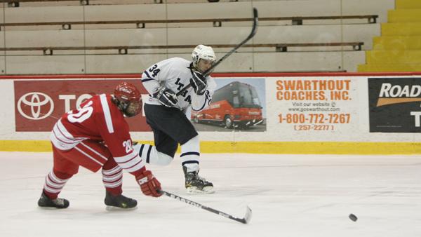 Then-junior Tim Finnerty prepares to battle for control of the puck during a January 2012 game against SUNY-Cortland. This year, four of the top five point scorers will be graduating.