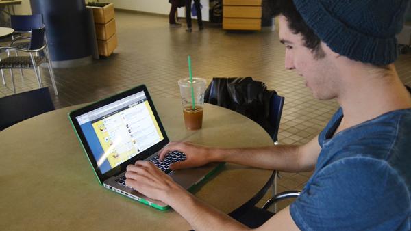 Sophomore Peter Marshall checks his “SpongeBob”-themed Twitter page, FoxyGrandpa62, Feb. 15 in IC Square Marshall created the Twitter handle with his high school friend, Tori Mueller, and it has more than 29,000 followers.
