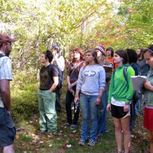 On left, Jason Hamilton, associate professor and chair of environmental studies, leads students through Ithaca College Natural Lands. The lands include almost 600 acres of protected area. Courtesy of Jake Brenner
