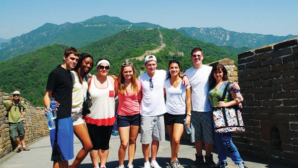 Business students stand on the the Great Wall of China during the School of Businesss study abroad trip in the summer of 2011.