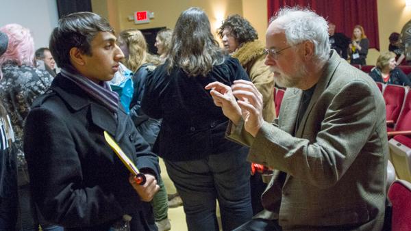 From left, junior Gautam Singhani, an intern for FLEFF, stands with Vincent Grenier, a professor of film from SUNY-Binghamton, on March 3 at Cinemapolis. This is FLEFF’s 16th anniversary.	