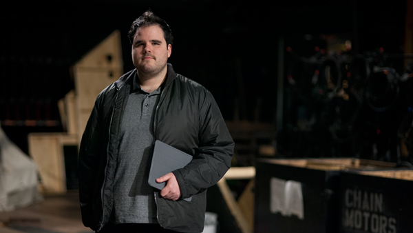 Senior Emilio Martinez Zurita de la Garza stands in front of the set of An Enemy of the People in Dillingham Center. Zurita is in charge of the set design for the Main Stage Theater play that will open in May. 
