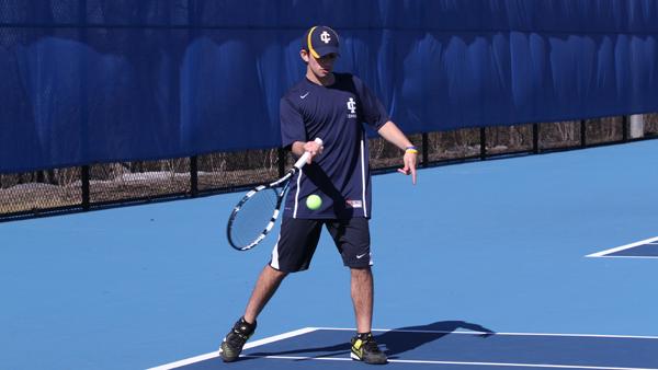 Freshman Chris Hayes hits the ball during a doubles match against Utica College on April 17 at the Wheeler Tennis Courts. The Bombers defeated the Pioneers 9-0 in the Empire 8 matchup.
