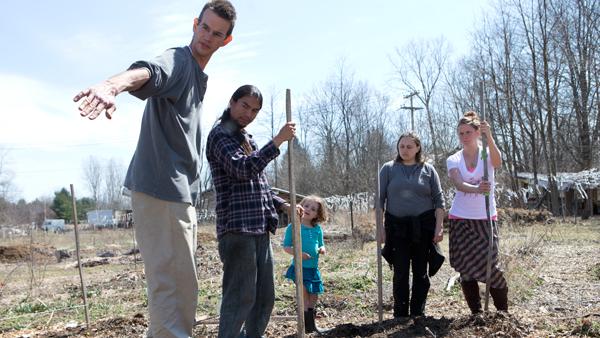 Volunteers work the land at the Veterans Sanctuary garden in Trumansburg on Monday. The program is called Call to Farms. 