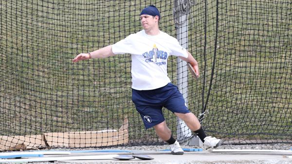 Junior thrower Christian Stremmel winds up to throw the discus during a practice April 13 at Butterfield Stadium. 