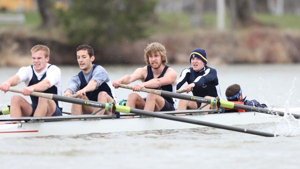 From left, sophomore Ryan Tomanocy, sophomore Dylan Kershaw, junior Ben Donnelly and sophomore Tyler Lemmons row to a first place finish during a team sweep on April 13 on the Cayuga Inlet. 
