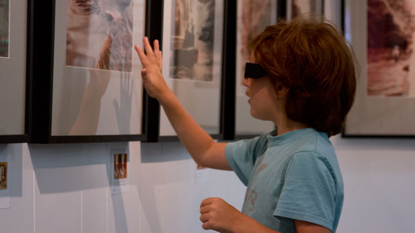 Ithaca resident Solomon Breen looks at the 3D sterographs at The Gallery at FOUND on Sept. 7.