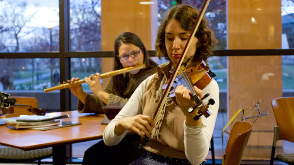 From left, Rachel Wagner, associate professor of philosophy and religion, and senior Alyssa  Rodriguez perform contra music on Nov. 15 in IC Square during the IC Open Contra Jam Session.