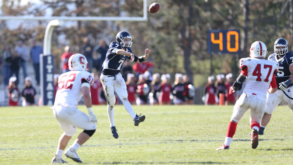 Junior quarterback Tom Dempsey throws the ball during the 55th annual Cortaca Jug on Nov. 16 at Butterfield Stadium. 