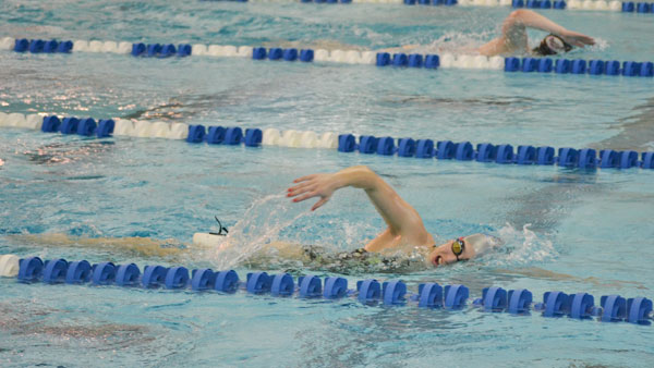 Freshman freestyle swimmer Jessica Ovalle pushes through a workout during the swimming and diving teams practice Nov. 19 in the Athletics and Events Center Aquatics Pavilion. 