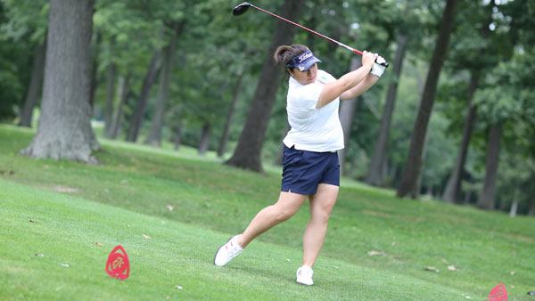 Junior Sharon Li looks after her drive during the teams inter-squad tournament on AUg. 31 at the Country Club of Ithaca. Li shot a 150 at the Empire 8 Championships on Sept. 14-15.
