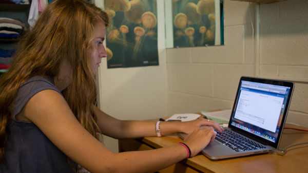 First-year student Mandy Congleton looks at her class schedule, which includes a seminar on one of six themes that are part of the Integrative Core Curriculum detailed in the IC 20/20 strategic plan.