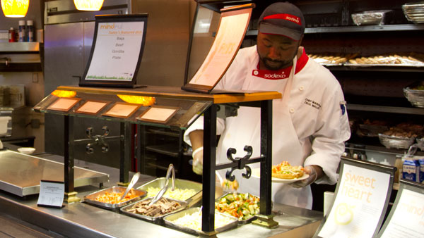 Chef Cecil Malone cooks during a shift Sept. 11 at Mindful at the Campus Center Dining Hall. Mindful is a new station at the dining hall that serves food with fewer than 600 calories. The station is located in the front of the dining hall.