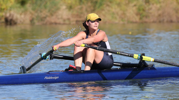 Senior captain Dominique Lessard rows toward the finish line during the Ithaca Sculling Invitational on Spet. 29 on the Cayuga Inlet.