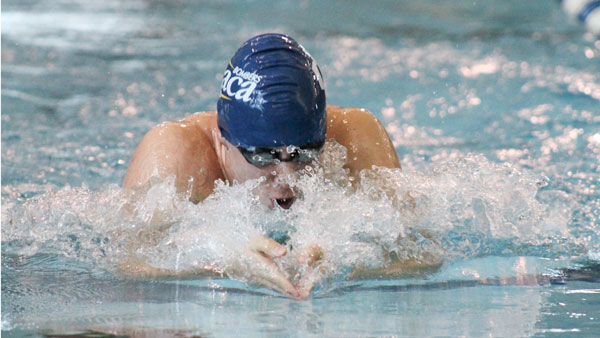 Freshman Eddie Mostert swims in the 100-yard breaststroke event during the Bombers’ meet against the SUNY-Cortland Red Dragons on Nov. 2 in the Athletics and Events Center Aquatics Pavilion.