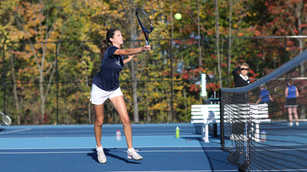 Junior Allison Vizgaitis hits the ball over the net during a game at the New York State Championships on Oct. 12 at the Wheeler Tennis Courts.