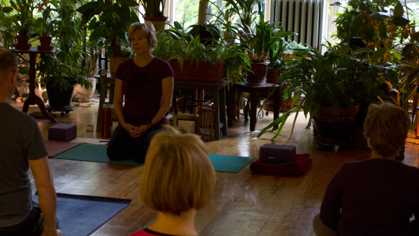 Lee Goodhew Romm, professor of performance studies, teaches her yoga class Sept. 27 at Sunrise Yoga on South Cayuga Street. Goodhew Romm was certified as a yoga instructor in June.