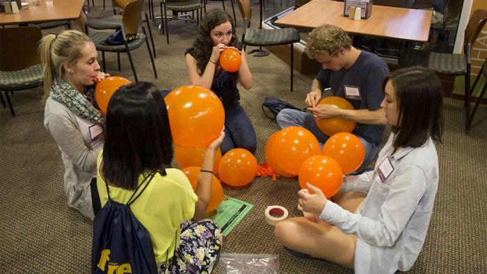 Students in the Class of 2017 participate in a balloon challenge during a social event at Orientation on June 19. The high number of first-years seeking on-campus housing in the fall is so high that the Office of Residential LIfe has had to make additional options available