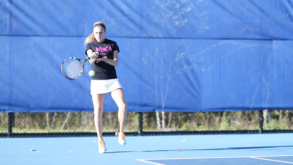 Junior Alyssa Steinweis hits the ball during the Blue and Gold’s Empire 8 contest against Hartwick College on Oct. 8 on the Wheeler Tennis Courts. The South Hill squad defeated the Hawks 9–0.