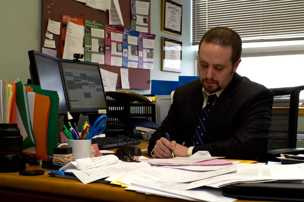 Bryan Roberts, assistant dean for student services in the Roy H. Park School of Communications, sits in his office Friday. Roberts was diagnosed with Parkinsons disease and is advocating for the Michael J. Fox foundation.
