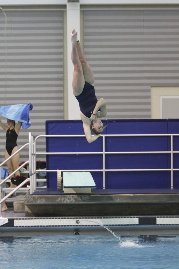 Freshman diver Nickie Griesemer attempts a 1 1/2-turn backflip while competing in the 1-meter dive during the Bomber Invitational on Dec. 6 at the Athletics & Events Center Aquatics Pavillion.