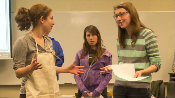 From left, seniors Talia Koren and Brennan Banta, and freshman Kate Zasowski rehearse for “Internal Struggle,” a sketch-comedy written and directed by Koren, on Dec. 3 in Friends 307.
