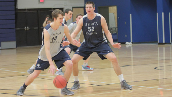From left, junior center Keefe Gitto calls for a teammate while senior center Tom Sweeney squares up to defend him. The Bombers’ five-game losing streak is the longest since 2005. 