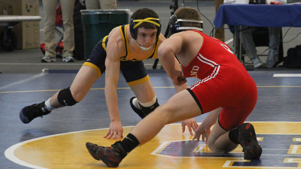 Sophomore Eamonn Gaffney sizes up his opponent from SUNY Cortland during the wrestling team’s meet with the Red Dragons and Wabash College on Jan. 25 in Glazer Arena. The Blue and Gold are 7–3 this season.