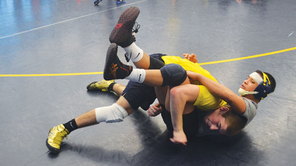 Sophomore Eamonn Gaffney performs a take down on sophomore Josue Escobar at the wrestling team’s practice Jan. 20 in the Hill Center. The Bombers currently have a 7–2 record this season.