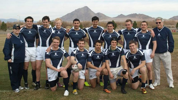 Players and coaches of the men’s club rugby team celebrate after playing a game in the Las Vegas Invitational on Jan. 23. The Bombers won two out of their three tournament games.