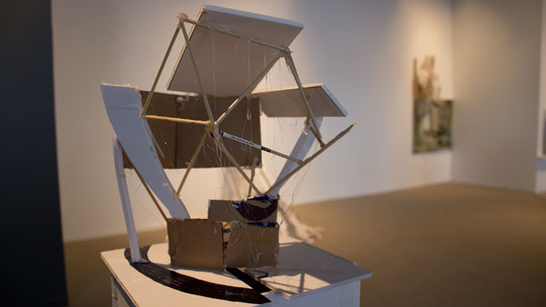 A found object structure made of cardboard and wood sits in the Handwerker Gallery. The piece is a part of the exhibit Your Margins, Your Rivers, Your Diminutive Villages by Patte Loper, who will give a talk at 6 p.m. Feb. 20 in the gallery.