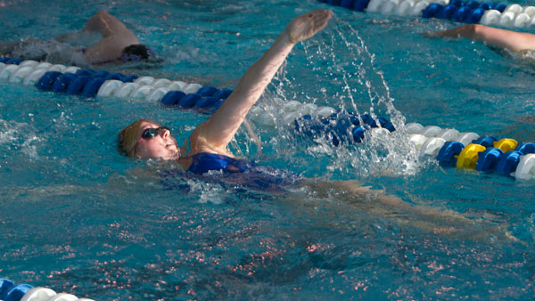 Freshman swimmer Grace Ayer practices her backstroke during the women’s swimming and diving team’s workout Feb. 18 at the Athletics and Events Center Aquatics Pavilion. 